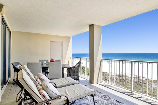 24900 Perdido Beach Blvd Unit 402, Orange Beach, AL 36561 - balcony featuring outdoor dining area, a water view, and a view of the beach