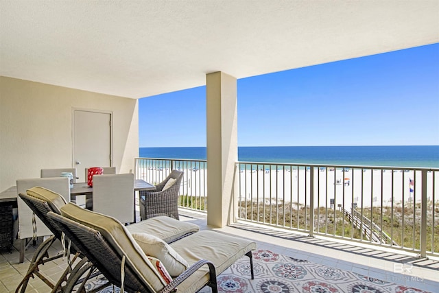 24900 Perdido Beach Blvd Unit 402, Orange Beach, AL 36561 - balcony featuring a water view, outdoor dining space, and a view of the beach