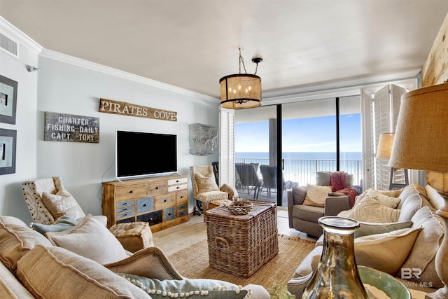 24900 Perdido Beach Blvd Unit 402, Orange Beach, AL 36561 - living area featuring crown molding, light wood-type flooring, and visible vents