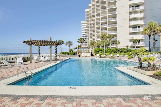 24900 Perdido Beach Blvd Unit 402, Orange Beach, AL 36561 - community pool with a patio, fence, and a pergola