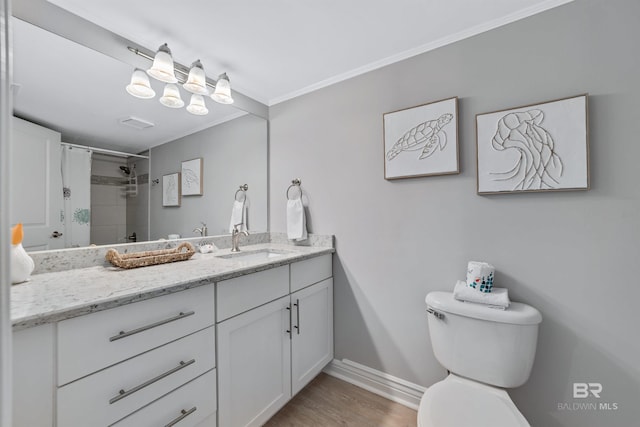 bathroom with ornamental molding, vanity, hardwood / wood-style floors, toilet, and curtained shower