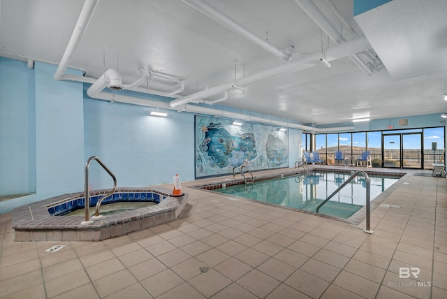 view of pool with an indoor hot tub