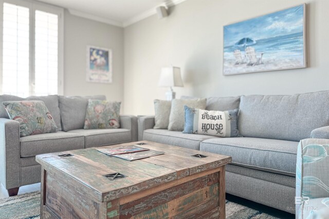 living room featuring light carpet and ornamental molding