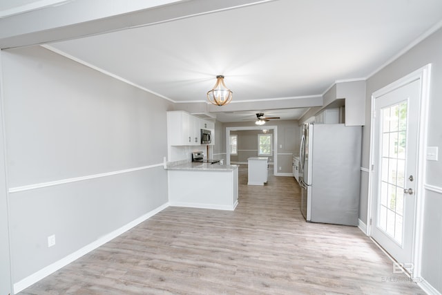 kitchen with white cabinetry, crown molding, stainless steel appliances, and light hardwood / wood-style flooring