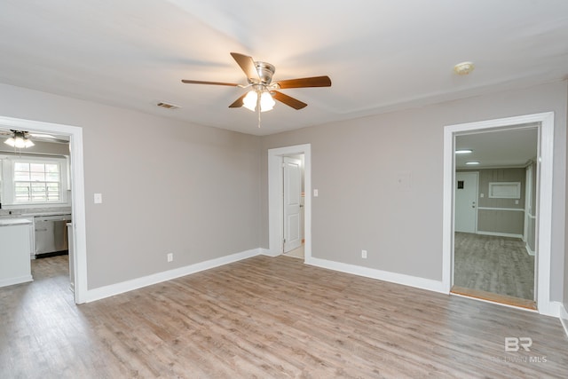 unfurnished room featuring ceiling fan and light hardwood / wood-style floors