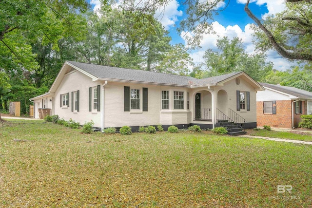 ranch-style house with a front lawn