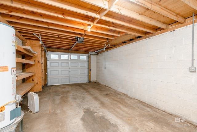 garage with gas water heater and a garage door opener