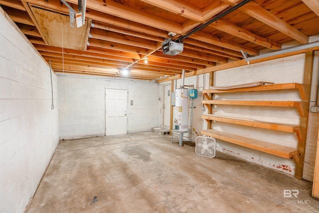 garage with gas water heater and a garage door opener