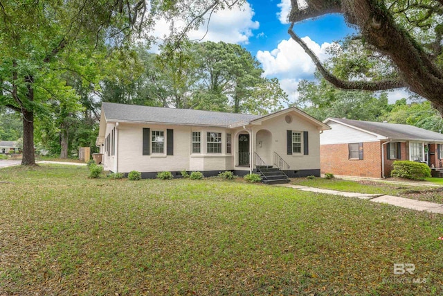 ranch-style house featuring a front lawn