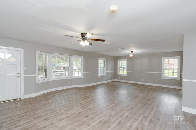 interior space with light hardwood / wood-style flooring and ceiling fan