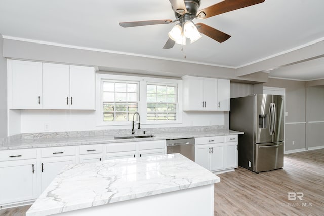 kitchen with white cabinets, sink, light stone countertops, light wood-type flooring, and stainless steel appliances