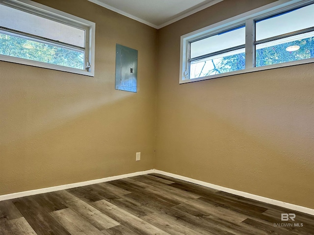 110 Lynnbrook Dr, Brewton, AL 36426 - unfurnished room featuring electric panel, crown molding, and hardwood / wood-style flooring