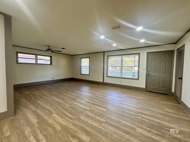 110 Lynnbrook Dr, Brewton, AL 36426 - spare room featuring ceiling fan, a healthy amount of sunlight, and light hardwood / wood-style floors