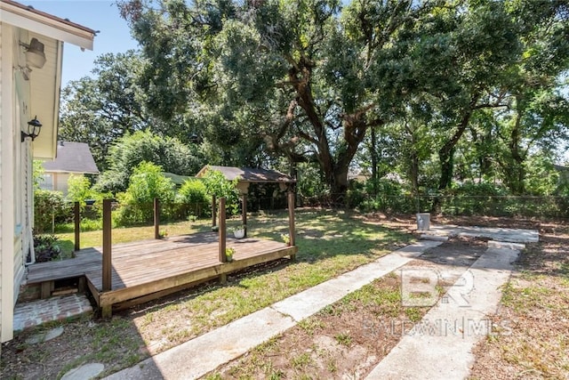 view of yard with a wooden deck