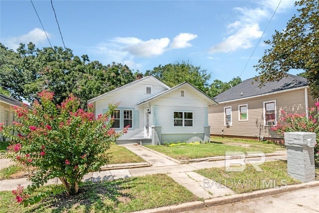 bungalow with a front lawn