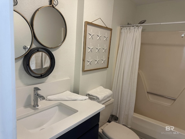 bathroom featuring vanity, toilet, and shower / bathtub combination with curtain