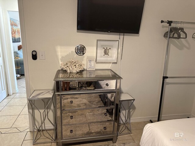 bedroom featuring light tile flooring