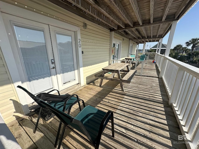 wooden deck featuring french doors