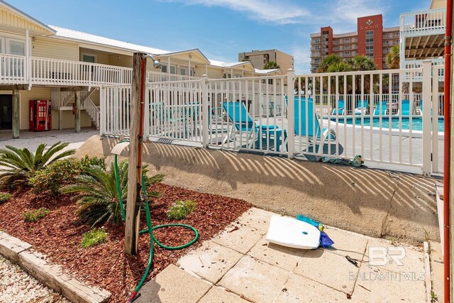 view of swimming pool with a patio