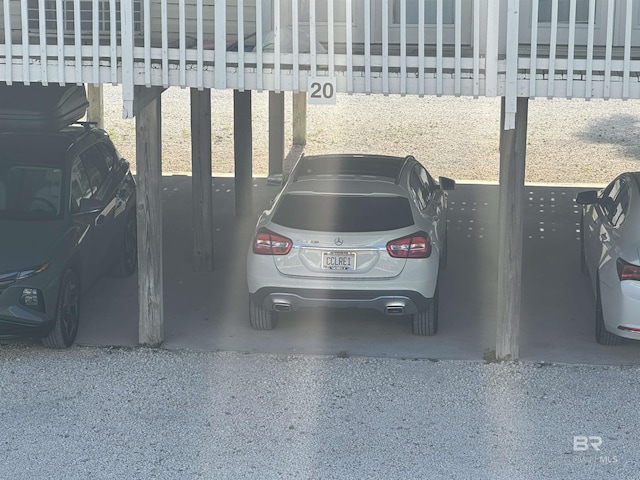 view of vehicle parking with a carport