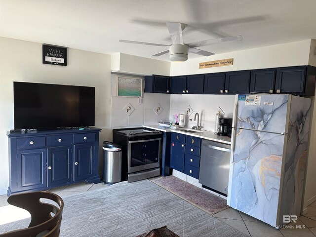 kitchen featuring ceiling fan, stainless steel dishwasher, white fridge, backsplash, and light tile floors