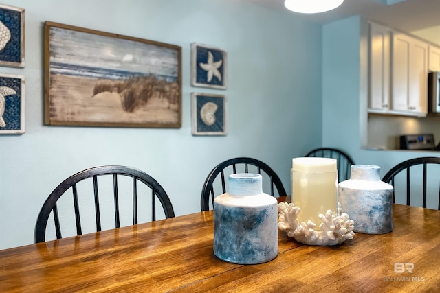 dining room with hardwood / wood-style floors