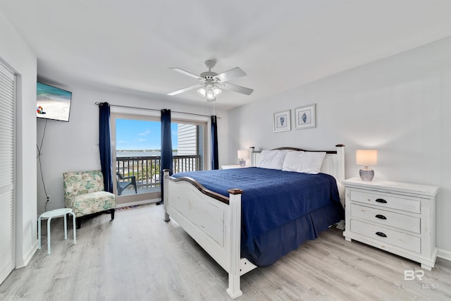 bedroom featuring light hardwood / wood-style flooring, access to exterior, and ceiling fan