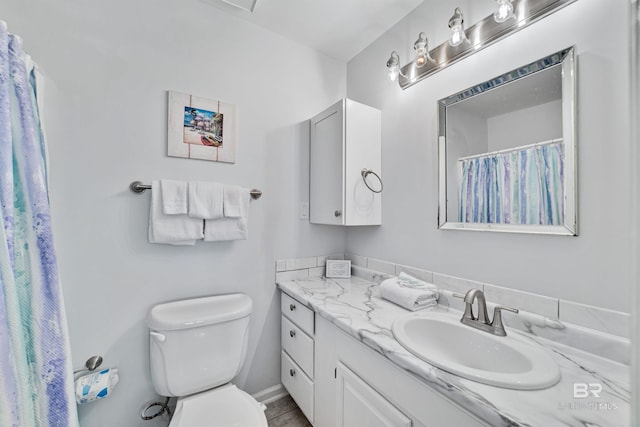 bathroom with vanity, toilet, and a shower with shower curtain