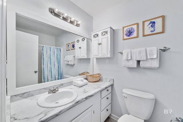 bathroom with toilet and vanity