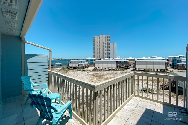 balcony featuring a water view