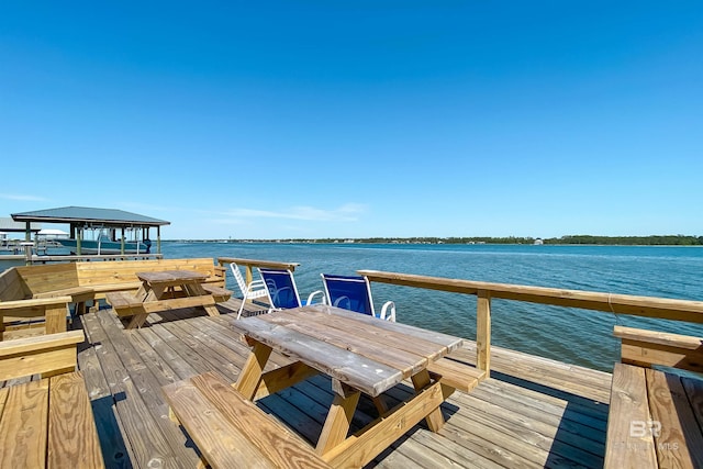 view of dock with a gazebo and a water view