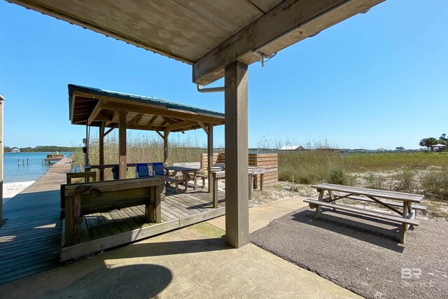 dock area featuring a deck with water view