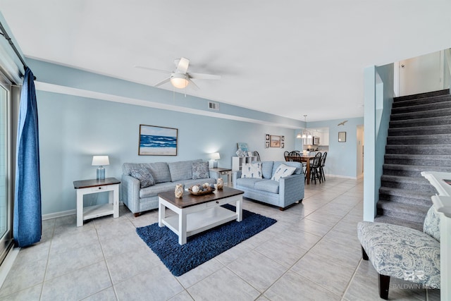 tiled living room featuring ceiling fan