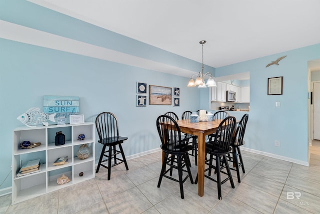 tiled dining area with a notable chandelier