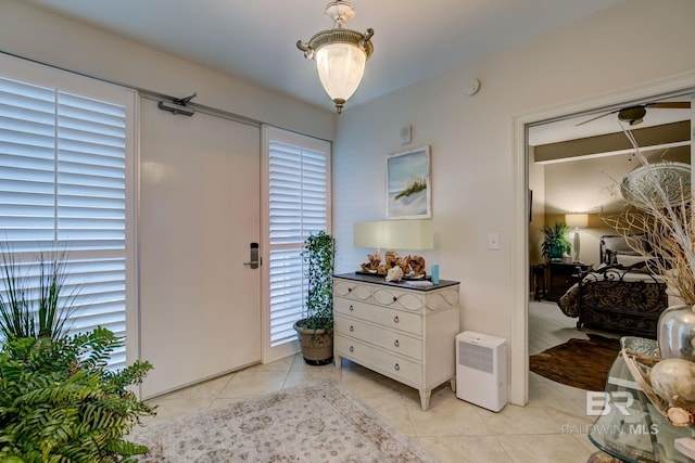 foyer entrance featuring light tile patterned flooring