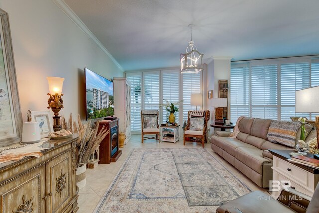 tiled living room featuring an inviting chandelier and crown molding