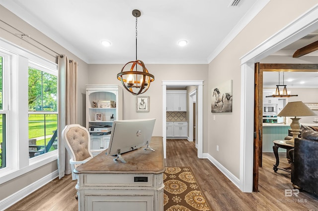 home office featuring hardwood / wood-style flooring, crown molding, and a chandelier