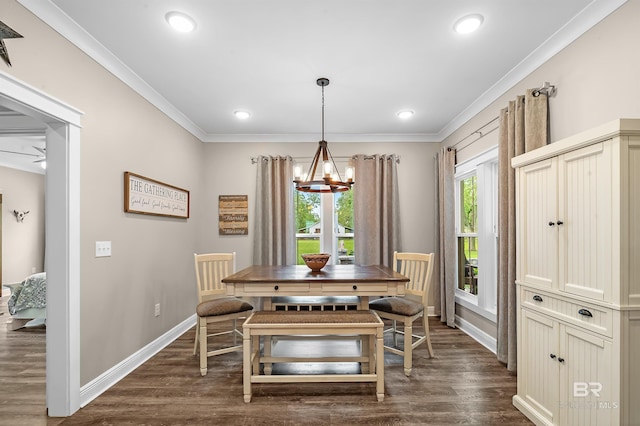 dining space featuring an inviting chandelier, dark wood-type flooring, and crown molding