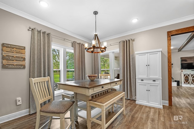 dining room featuring an inviting chandelier, dark wood-type flooring, and crown molding