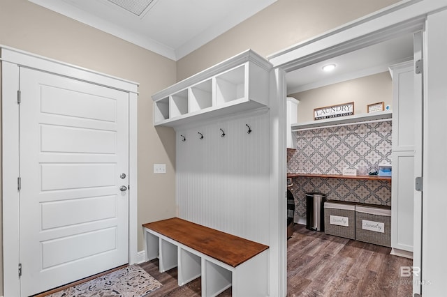 mudroom featuring dark hardwood / wood-style flooring and ornamental molding