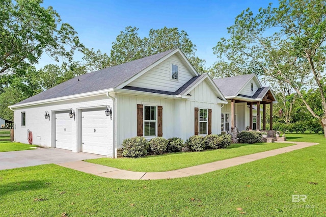 view of front of home with a garage and a front lawn