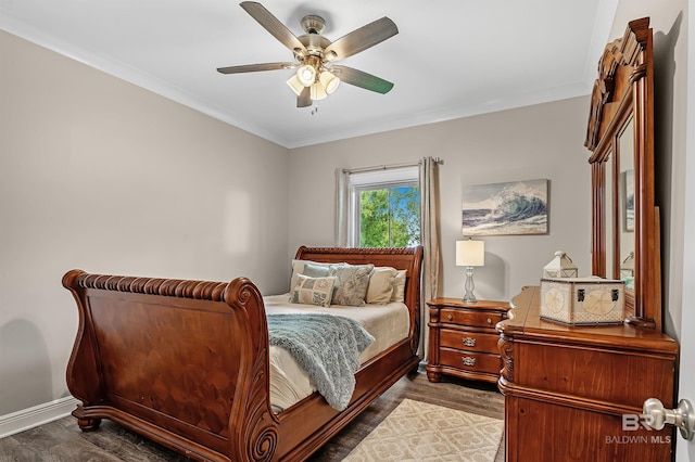 bedroom featuring ceiling fan and dark hardwood / wood-style flooring