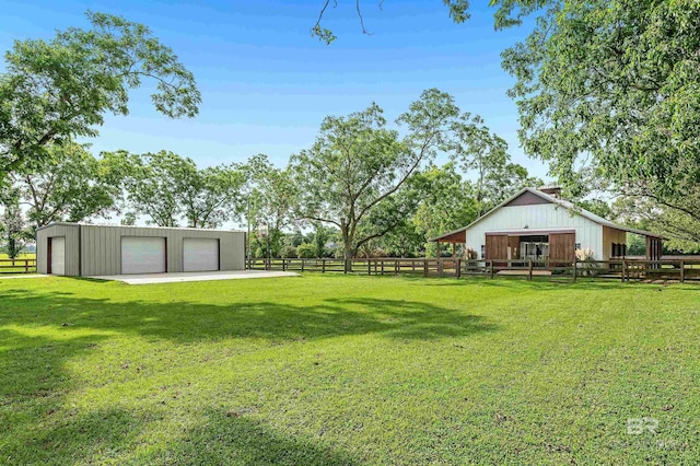 view of yard featuring an outbuilding and a garage