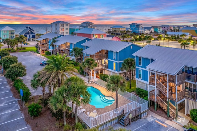 1500 W Beach Blvd Unit 312, Gulf Shores, AL 36542 - aerial view at dusk of a residential view and view of pool