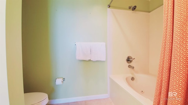 bathroom with shower / bath combo with shower curtain, tile flooring, and toilet