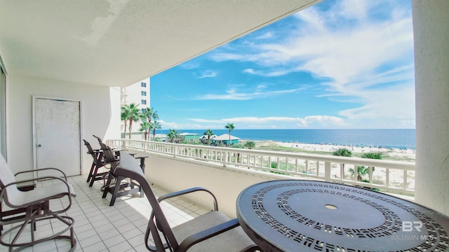 balcony with a view of the beach and a water view