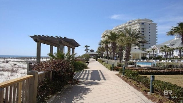 view of property's community featuring a pergola and a pool