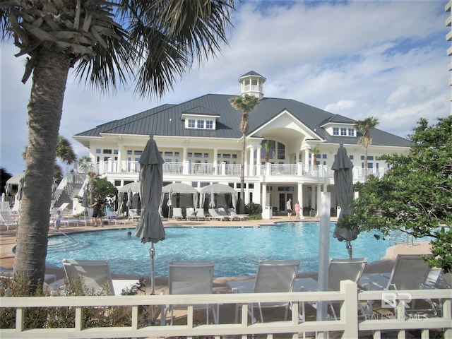 view of swimming pool with a patio area