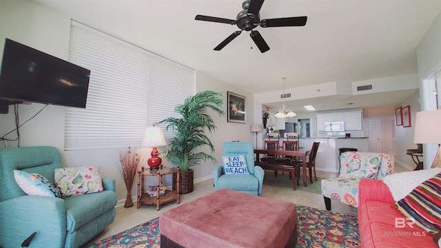 living room with ceiling fan and light tile floors