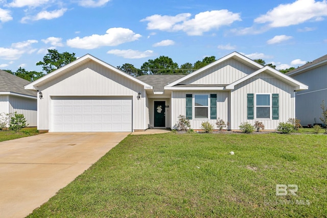 view of front of property with a front yard and a garage